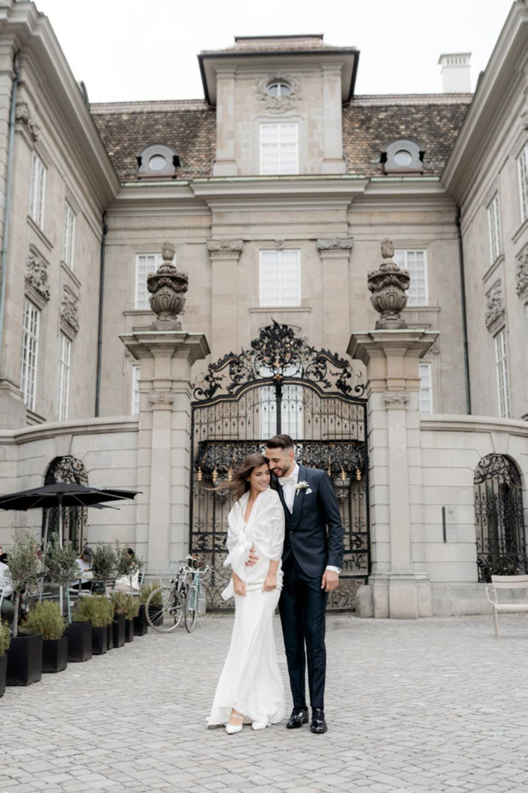The couple in front of a historic building