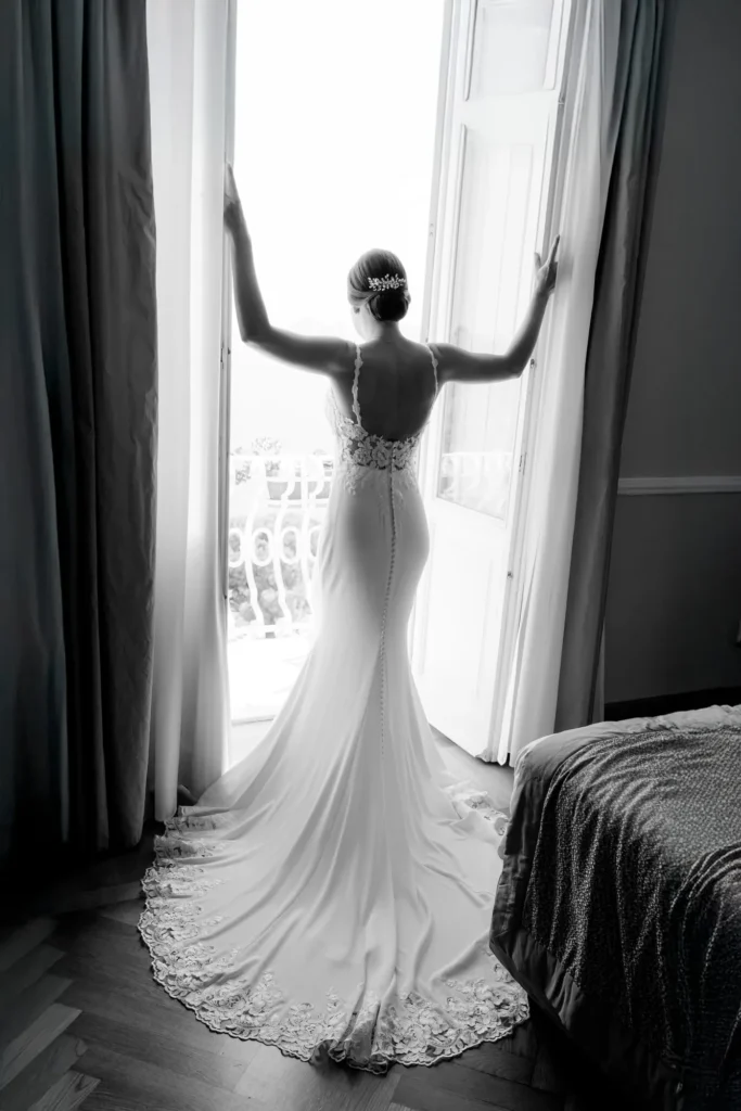 Bride by the window before her wedding in Portofino