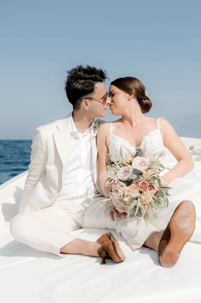 The couple on a motorboat off Portofino