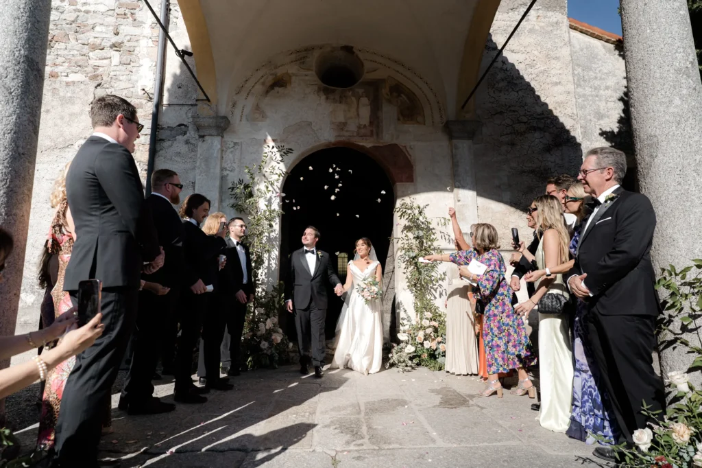 The couple walking out to applause, Castello Dal Pozzo