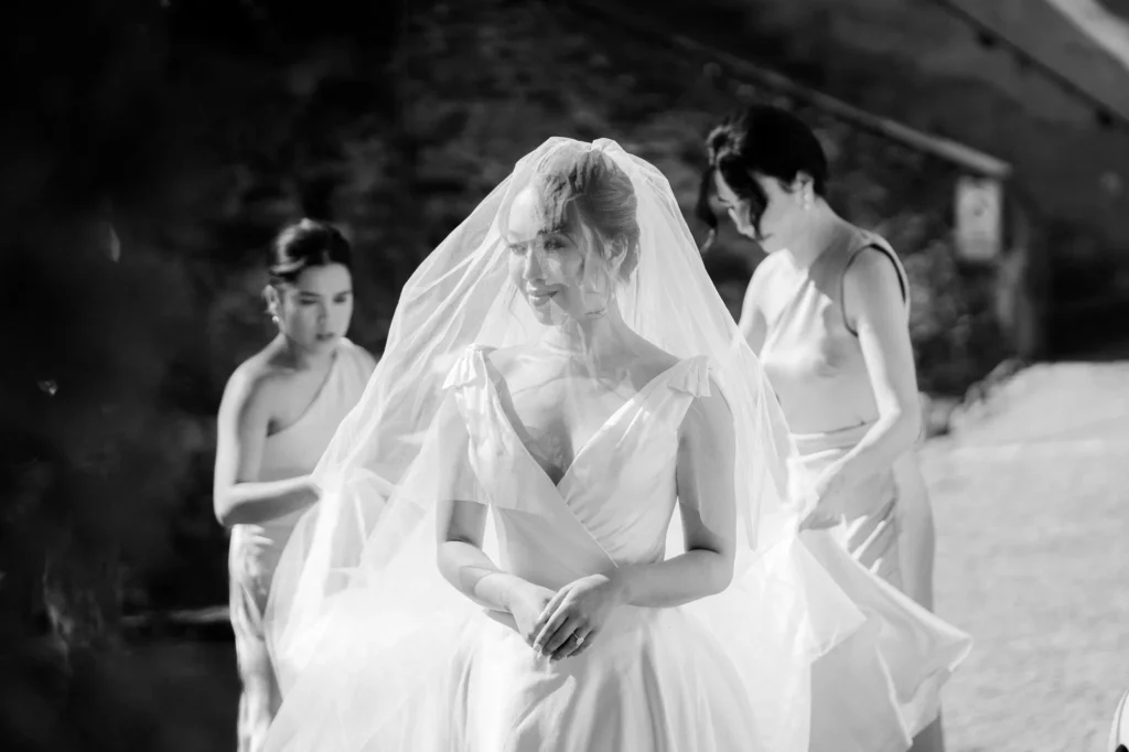 Bridesmaids arranging the bride’s veil, Castello Dal Pozzo